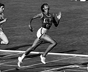 Photo Black track star Wilma Rudolph 20 lunging across the finish line as she wins 100 meter dash in 11 seconds to win one of her 3 gold medals at the 1960 Summer Olympics